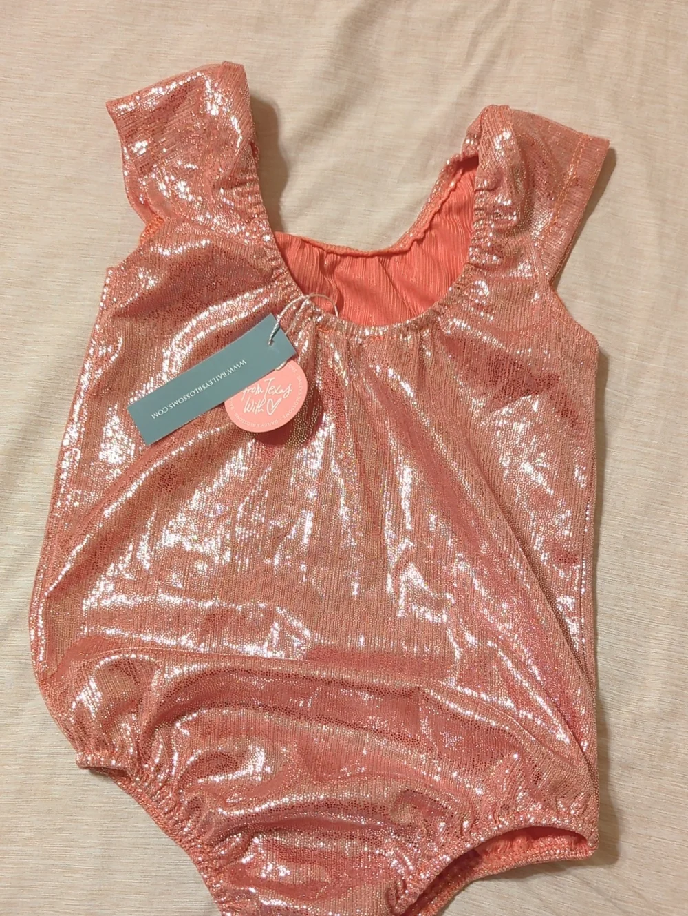 Shimmery Pink Girls' One-Piece Bodysuit by (no brand visible)